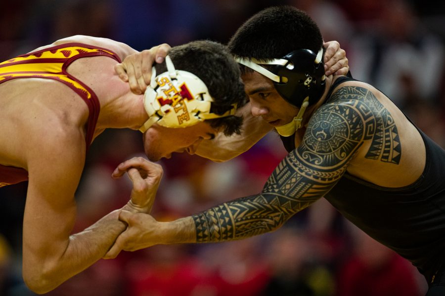 Iowa's 149-pound Pat Lugo wrestles Iowa State's Jarrett Degen during a wrestling dual meet between Iowa and Iowa State at the Hilton Coliseum in Ames on Sunday, November 24, 2019. Lugo won by decision, 4-3, and the Hawkeyes defeated the Cyclones, 29-6. (Shivansh Ahuja/The Daily Iowan)