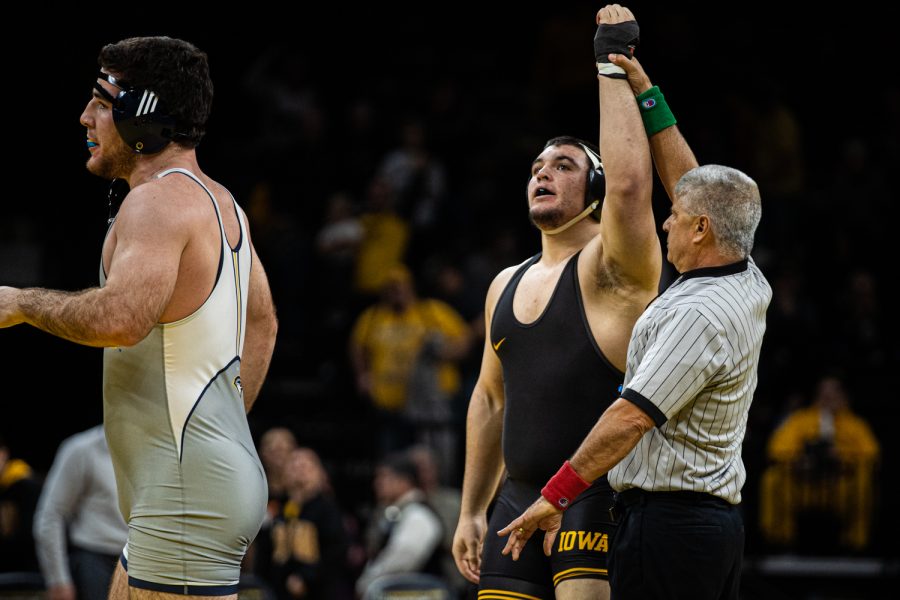 Iowas+285-pound+Tony+Cassioppi+celebrates+a+win+against+UTCs+Grayson+Walthall+during+a+wrestling+dual-meet+between+Iowa+and+Tennessee-Chattanooga+at+Carver-Hawkeye+Arena+on+Sunday%2C+Nov.+17%2C+2019.+Cassioppi+won+by+fall+in+1%3A45%2C+and+the+Hawkeyes+defeated+the+Mocs%2C+39-0.+%28Shivansh+Ahuja%2FThe+Daily+Iowan%29