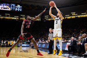 Iowa guard Jordan Bohannon attempts a 3-pointer during a mens basketball game between Iowa and Southern Illinois-Edwardsville at Carver-Hawkeye Arena on Friday, Nov. 8, 2019. The Hawkeyes defeated the Cougars, 87-60. (Shivansh Ahuja/The Daily Iowan)