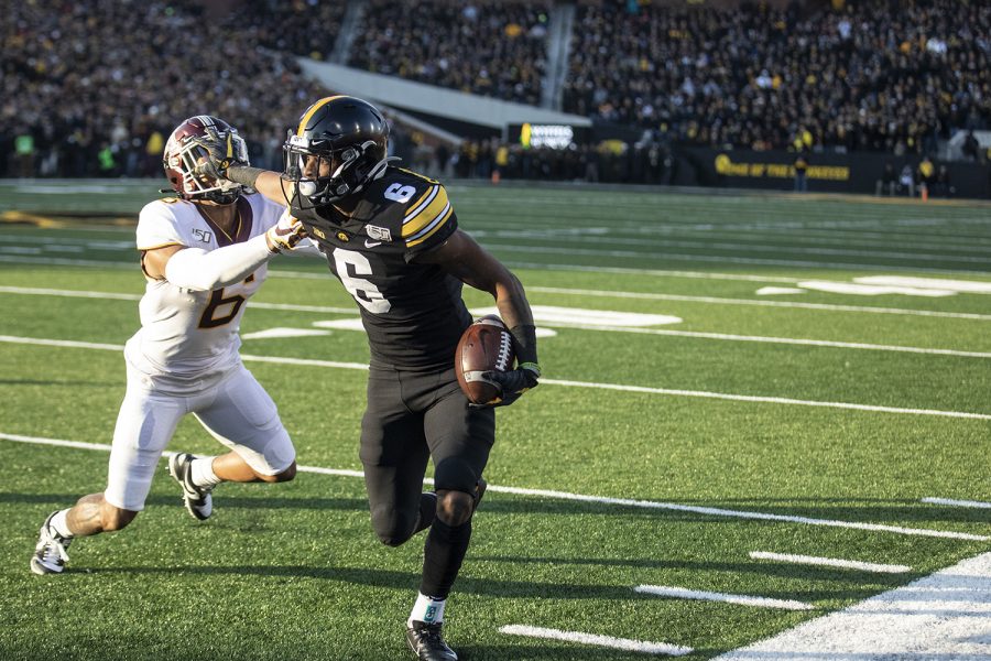 Iowa wide receiver Ihmir Smith-Marsette stiff arms Minnesota defensive back Chris Williamson during a football game between Iowa and Minnesota at Kinnick Stadium on Saturday, November 16, 2019. Smith-Marsette had 4 catches for 43 yards in the game.