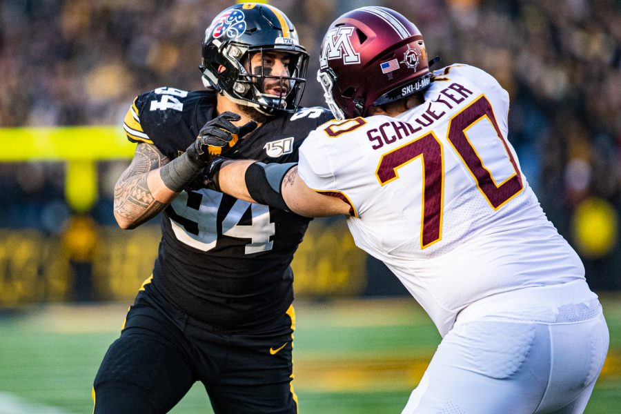 Iowa defensive end AJ Epenesa rushes the passer during a football game between Iowa and Minnesota at Kinnick Stadium on Saturday, Nov. 16, 2019. Epenesa finished with 2.5 sacks on the day.