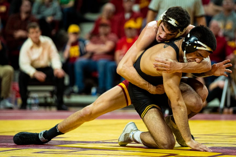 Iowas 149-pound Pat Lugo wrestles Iowa States Jarrett Degen during a wrestling dual meet between Iowa and Iowa State at the Hilton Coliseum in Ames on Sunday, November 24, 2019. Lugo won by decision, 4-3, and the Hawkeyes defeated the Cyclones, 29-6.