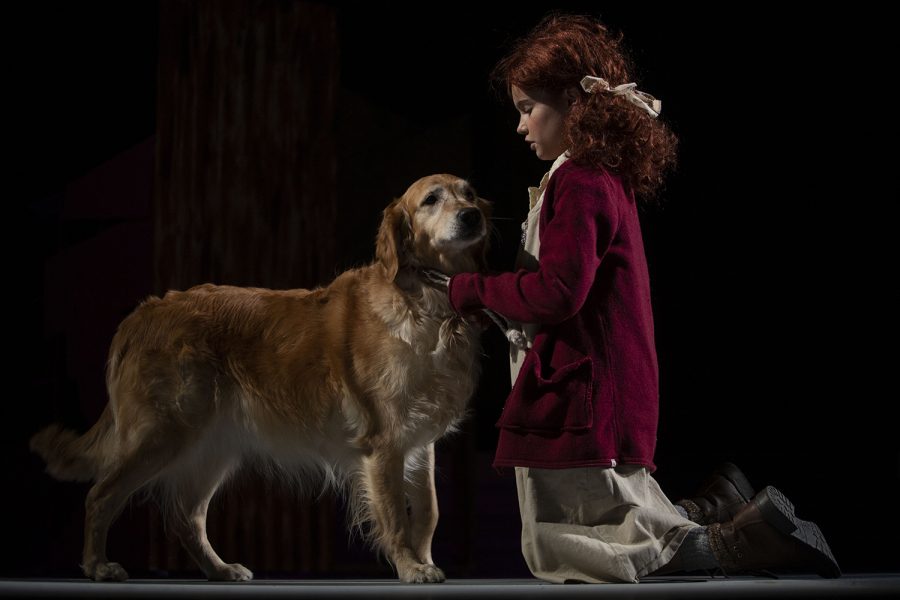 Camila Koch performs with a dog as Annie during a dress rehearsal of Annie at the Coralville Center for the Performing Arts on Wednesday, Dec. 4, 2019. The musical, directed by Liz Tracey, will open Friday, Dec. 6. 