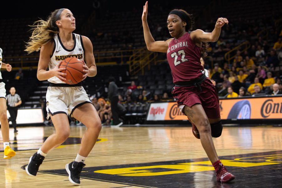 Iowa guard Kate Martin attemps to shoot the ball past NC Centrals Zaria Atkins during a game against North Carolina Central University on Saturday, Dec. 14, 2019 at Carver Hawkeye Arena. The Hawkeyes defeated the Eagles, 102-50.