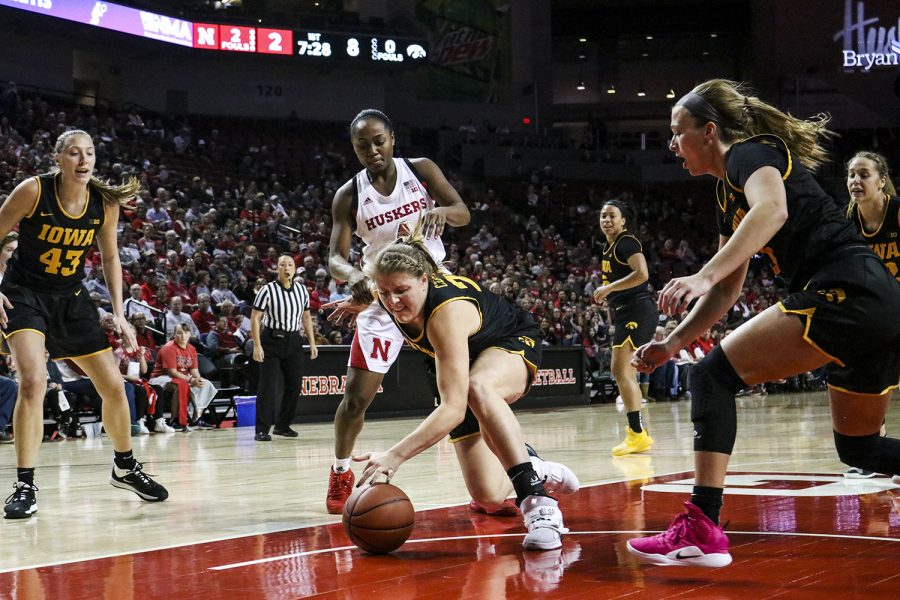 Iowa center Monika Czinano goes to steal the ball from a Husker player during a womenÕs basketball game between Iowa and Nebraska at Pinnacle Bank Arena in Lincoln, Nebraska on Saturday, December 28. The Hawkeyes fell to the Huskers 78-69. (Nichole Harris/The Daily Iowan)