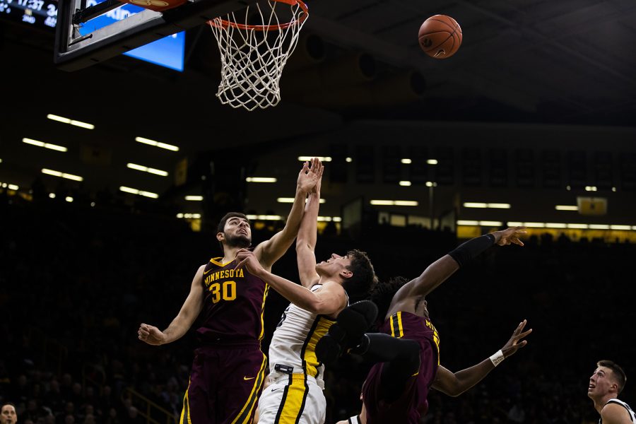 Iowa center Luka Garza jumps for the ball during the mens basketball game against Minnesota at Carver-Hawkeye Arena on Monday, December 9, 2019. The Hawkeyes defeated the Gophers 72-52.