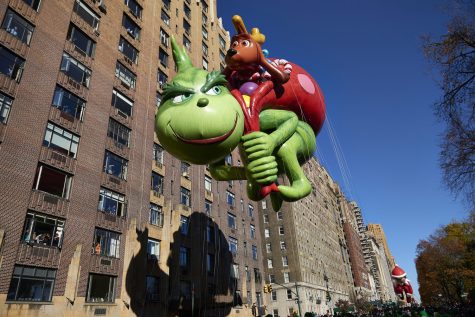 The Grinch balloon floats down Central Park West during the 91st Annual Macy's Thanksgiving Day Parade on Thursday, Nov. 23, 2017 in Manhattan, N.Y.  (James Keivom/New York Daily News/TNS)