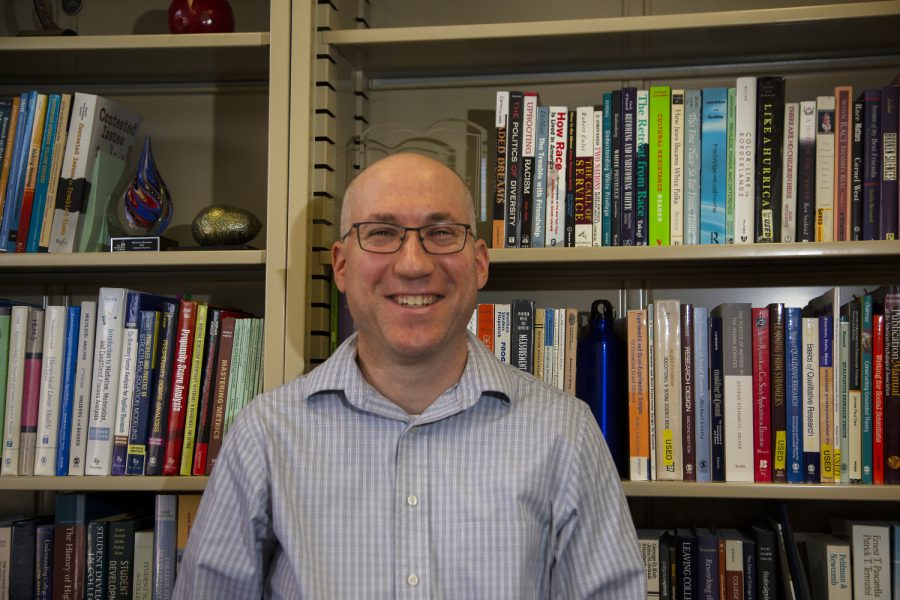 University of Iowa professor Nicholas Bowman is seen in his office located in he Lindquist Center on Monday, December 2, 2019. Bowman is the lead author in the research on what graduates get out of college once they have graduated.