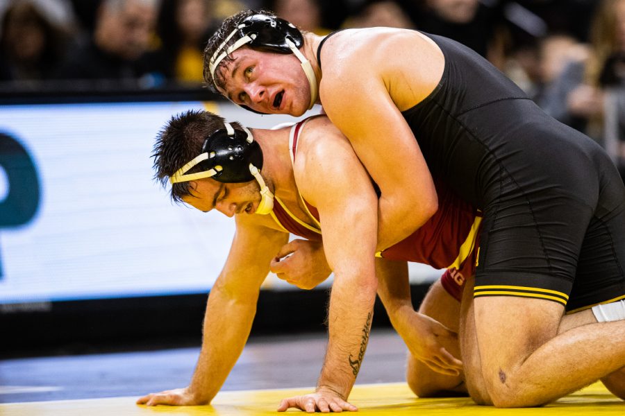 Iowa’s 194-pound Jacob Warner wrestles Wisconsin’s Taylor Watkins during a wrestling match between No.1 Iowa and No. 6 Wisconsin at Carver-Hawkeye Arena on Sunday, Dec. 1, 2019. Warner won by decision, 5-2, and the Hawkeyes defeated the Badgers, 32-3. 