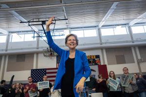 Senator Elizabeth Warren, D-Mass. waves to the audience following a town hall event at North Central Junior High School in North Liberty on Saturday, December 21, 2019. 