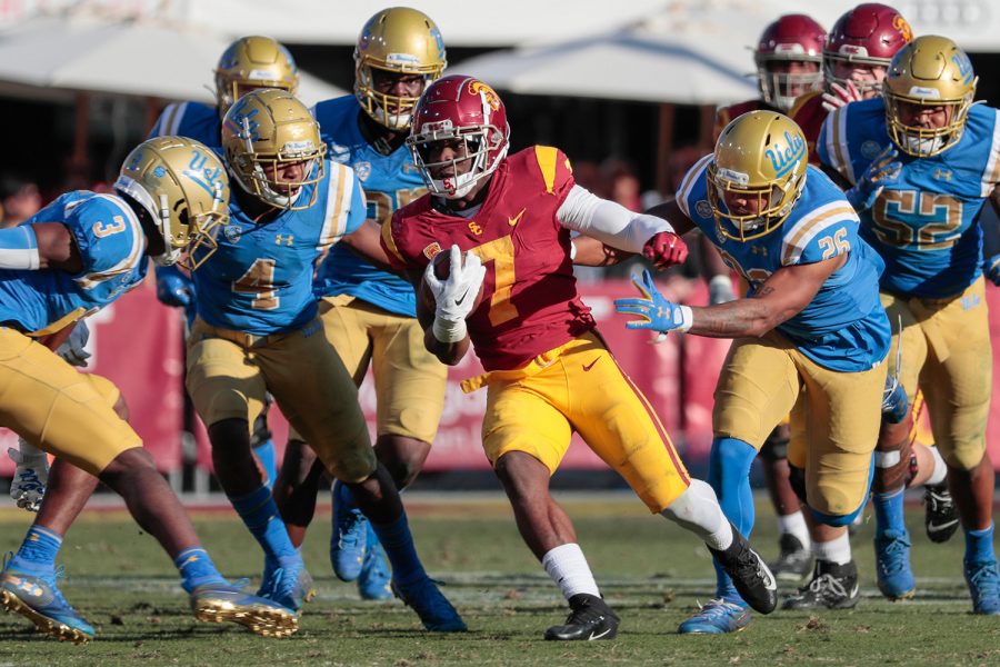 USC running back Stephen Carr (7) picks up second-half yardage against UCLA at the Los Angeles Memorial Coliseum on Saturday, Nov. 23, 2019, in Los Angeles. USC won, 52-35. (Robert Gauthier/Los Angeles Times/TNS)