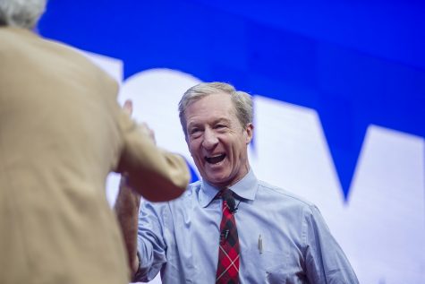Democratic candidate Tom Steyer laughs with moderator Art Cullen during the Teamsters Presidential Candidate Forum in the Veterans Memorial Coliseum in Cedar Rapids on Saturday, Dec. 7, 2019.