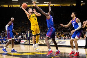 Iowa guard Jordan Bohannon shoots during a game against Depaul at Carver Hawkeye Arena on Monday, November 11, 2019. The Hawkeyes were defeated by the Blue Demons 93-78.