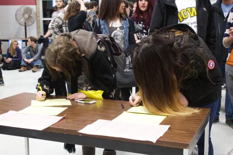 Students and members of the community sign in to caucus for the Democrat Party in the Robert Lee Rec Center on February 1, 2016.