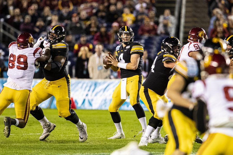 Iowa quarterback Nate Stanley drops back to pass during the 2019 SDCCU Holiday Bowl between Iowa and USC in San Diego on Friday, Dec. 27, 2019. 