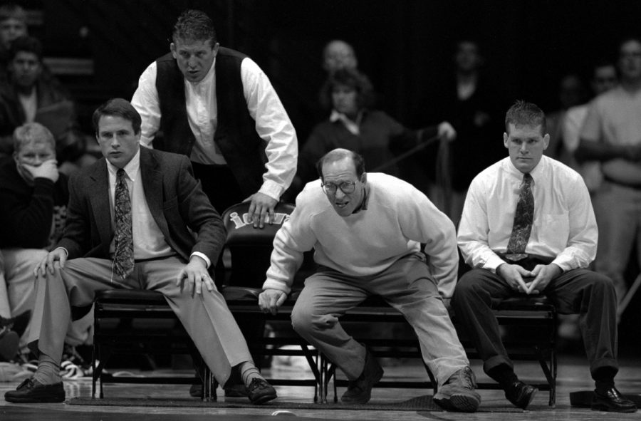 (From left) Iowa assistant coach Jim Zalesky, Royce Alger, head coach Dan Gable and Tom Brands give encouragement during a meet.