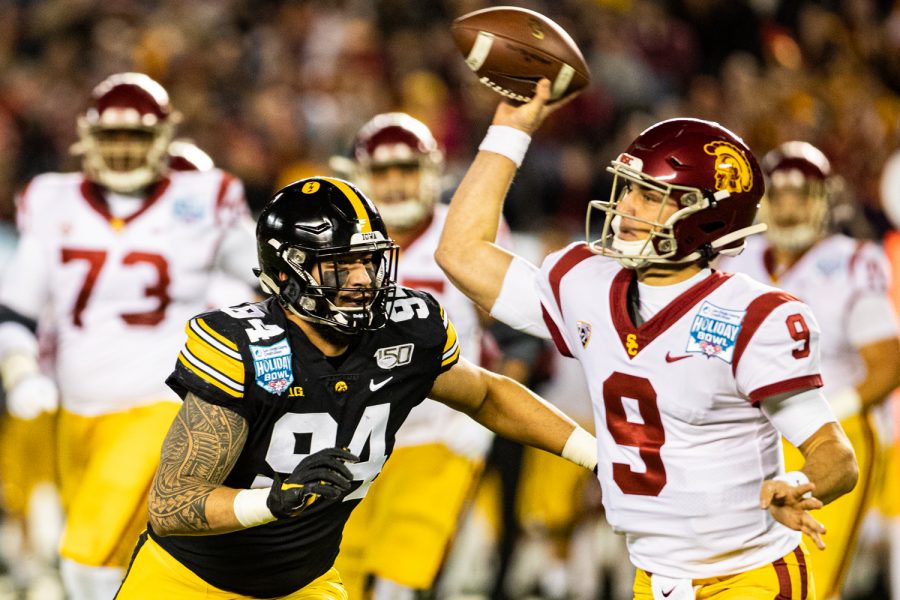Iowa+defensive+end+AJ+Epenesa+pursues+USCs+Kedon+Slovis+during+the+2019+SDCCU+Holiday+Bowl+between+Iowa+and+USC+in+San+Diego+on+Friday%2C+Dec.+27%2C+2019.+The+Hawkeyes+defeated+the+Trojans%2C+49-24.+