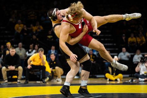 Iowa’s 285-pound Tony Cassioppi wrestles Wisconsin’s Trent Hillger during a wrestling match between No.1 Iowa and No. 6 Wisconsin at Carver-Hawkeye Arena on Sunday, Dec. 1, 2019. Cassioppi won by decision, 3-2, and the Hawkeyes defeated the Badgers, 32-3. (Shivansh Ahuja/The Daily Iowan)