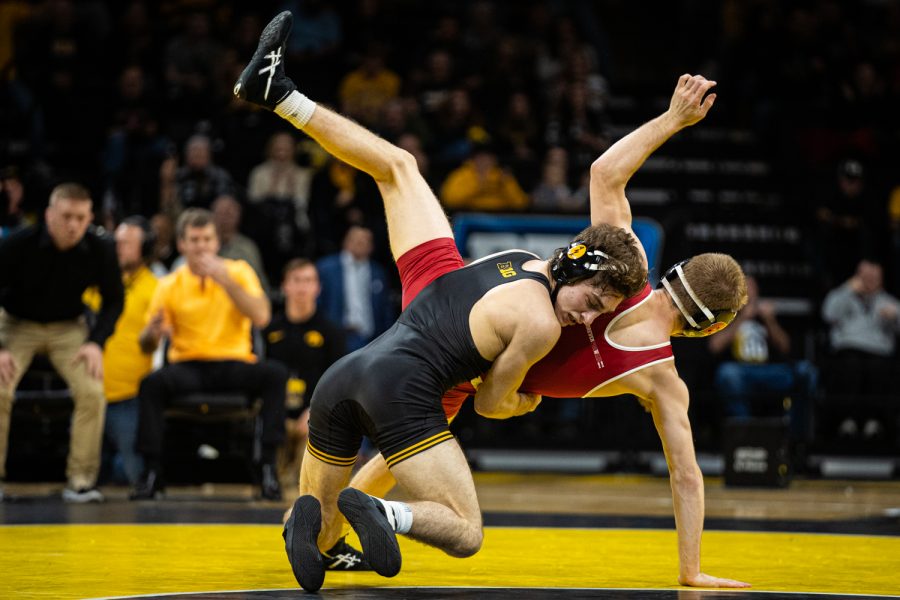 Iowa%E2%80%99s+133-pound+Austin+DeSanto+wrestles+Wisconsin%E2%80%99s+Seth+Gross+during+a+wrestling+match+between+No.1+Iowa+and+No.+6+Wisconsin+at+Carver-Hawkeye+Arena+on+Sunday%2C+Dec.+1%2C+2019.+DeSanto+won+by+decision%2C+6-2%2C+and+the+Hawkeyes+defeated+the+Badgers%2C+32-3.+