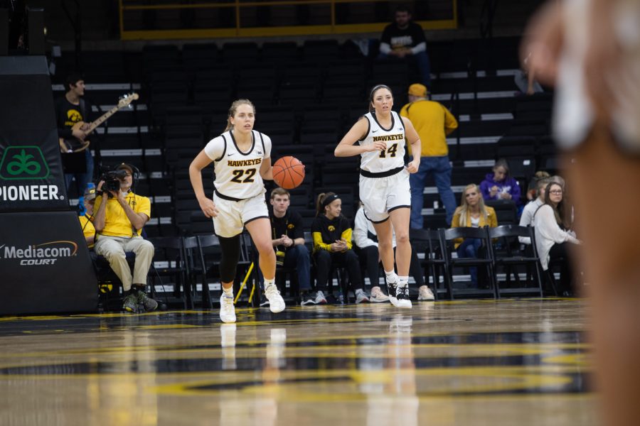 Iowa+guard+Kathleen+Doyle+%2822%29+and+McKenna+Warnock+run+down+the+court+during+a+game+against+North+Carolina+Central+University+on+Saturday%2C+Dec.+14%2C+2019+at+Carver+Hawkeye+Arena.+The+hawkeyes+defeated+the+eagles%2C+102-50.+%28Emily+Wangen%2FThe+Daily+Iowan%29