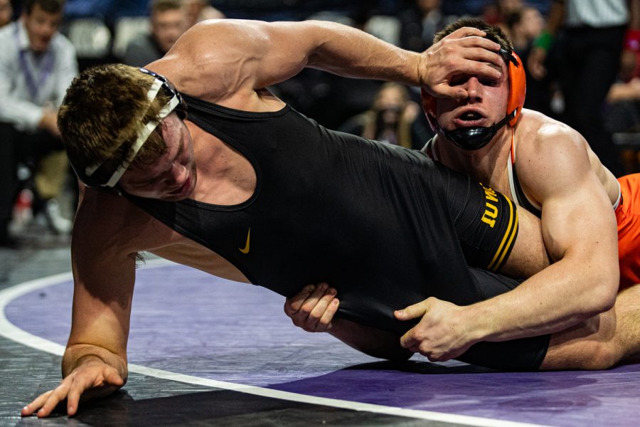 Iowa’s 197-pound Jacob Warner wrestles Princeton’s Pat Brucki during the fourth session of the 57th Annual Ken Kraft Midlands Championships at the Sears Centre in Hoffman Estates, IL, on Monday, Dec. 30, 2019. Brucki won by decision, and placed third in the weight class.