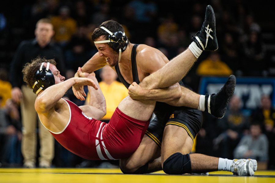 Iowa’s 174-pound Michael Kemerer wrestles Wisconsin’s Jared Krattiger during a wrestling match between No.1 Iowa and No. 6 Wisconsin at Carver-Hawkeye Arena on Sunday, Dec. 1, 2019. Kemerer won by a fall in 5:46, and the Hawkeyes defeated the Badgers, 32-3.