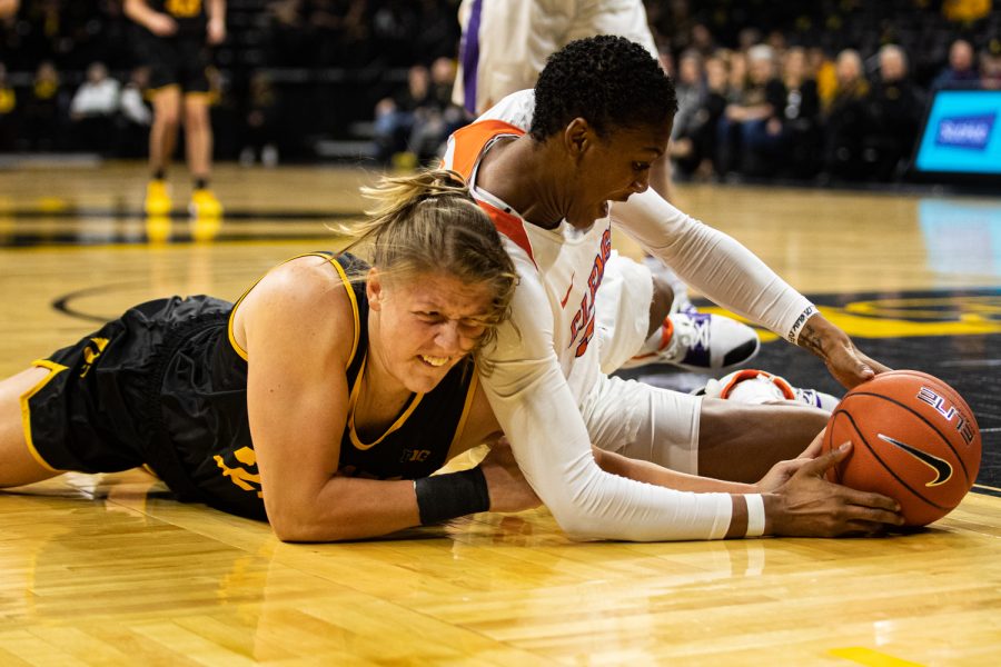 Iowa's Monika Czinano and Clemson's Tylar Bennett reach for the ball during a women’s basketball match between Iowa and Clemson at Carver-Hawkeye Arena on Wednesday, Dec. 4, 2019. The Hawkeyes defeated the Tigers, 74-60.