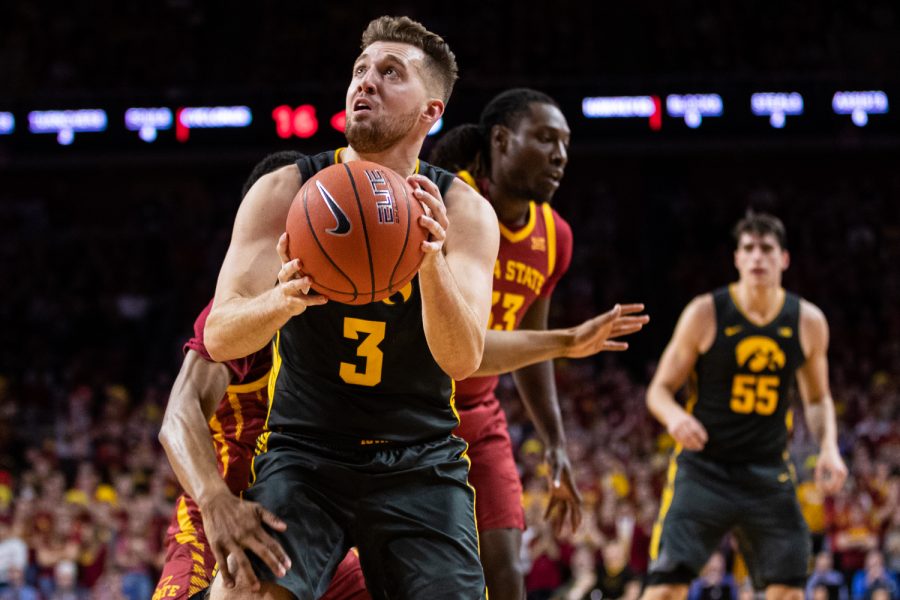 Iowa guard Jordan Bohannon looks to the backboard during a menÕs basketball match between Iowa and Iowa State at Hilton Coliseum on Thursday, Dec. 12, 2019. Bohannon finished with 12 points.