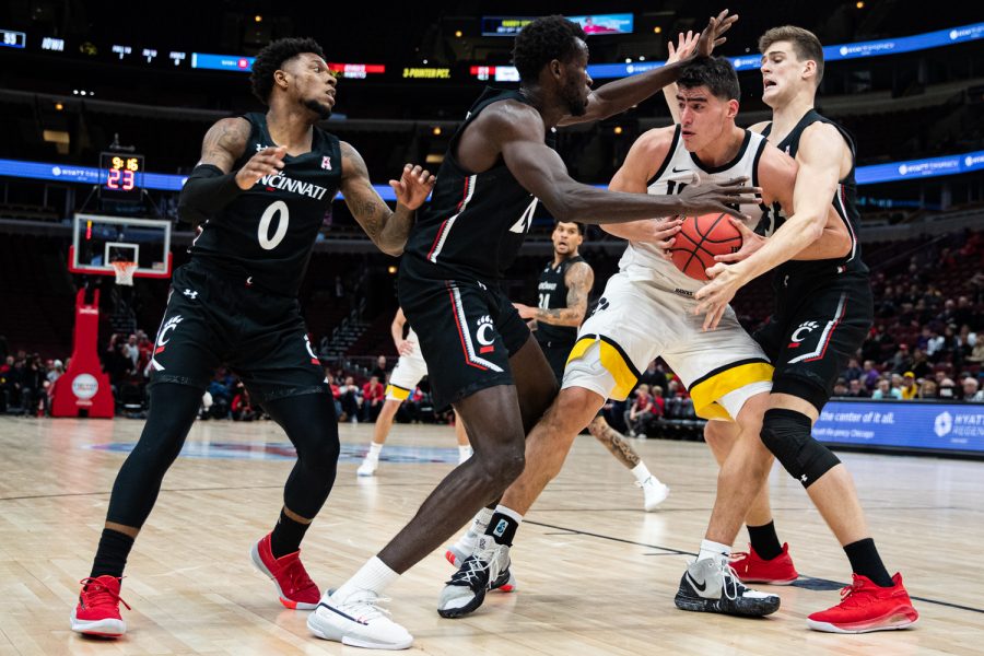 Iowa forward Luka Garza drives to the net during a men’s basketball match between Iowa and Cincinnati at the United Center in Chicago on Saturday, Dec. 21, 2019. The Hawkeyes defeated the Bearcats, 77-70.