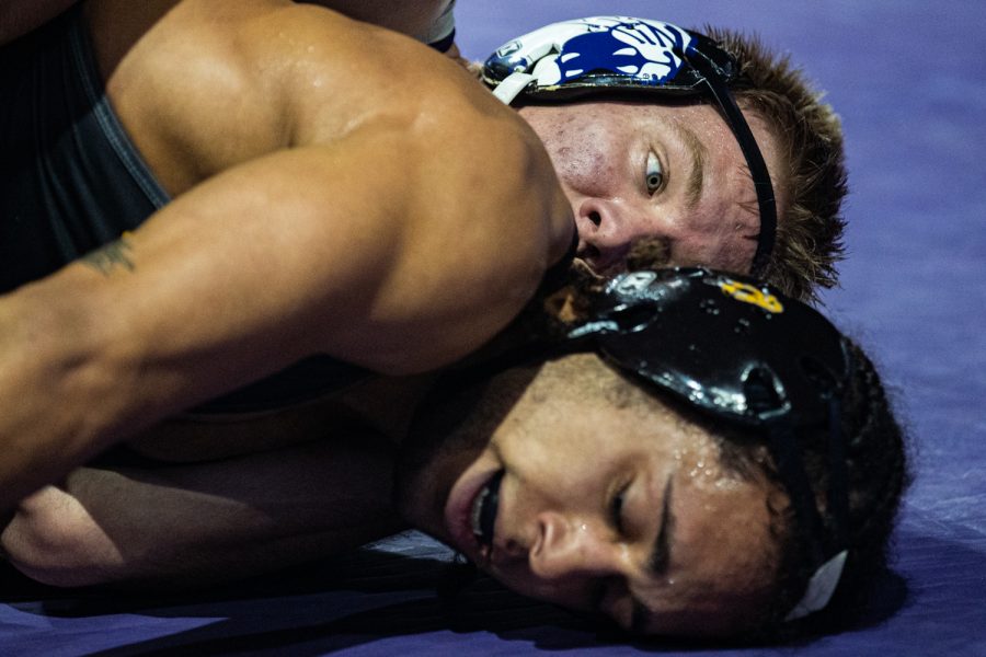 Iowa’s 165-pound Jeremiah Moody wrestles Northwestern’s Shayne Oster during the first session of the 57th Annual Ken Kraft Midlands Championships at the Sears Centre in Hoffman Estates, IL, on Sunday, Dec. 29, 2019. Oster won by major decision, 13-5.