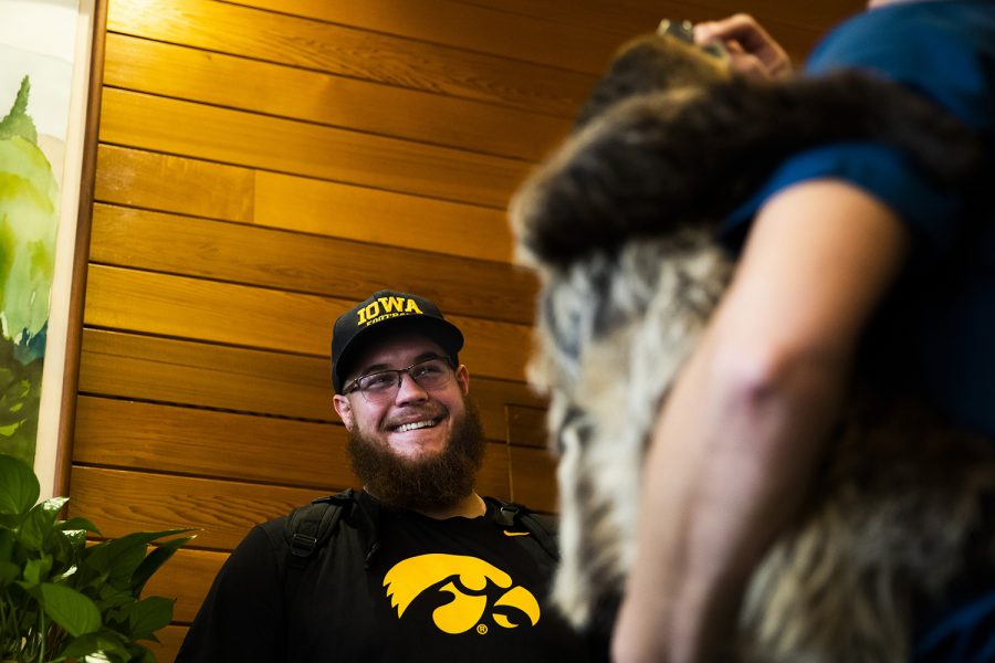 Iowa offensive lineman Levi Paulsen laughs looking at a two-toed sloth during the teams visit of the San Diego Zoo on Wednesday, December 25, 2019. 