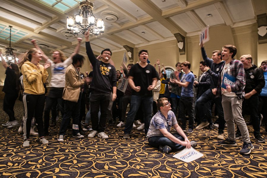 A group of Bernie Sanders supporters celebrate after the final alignment at the University of Iowa Mock Caucus on Friday, January 31st, 2020. The Mock Caucus is a sponsored event designed to train students for the upcoming Iowa Caucuses. 