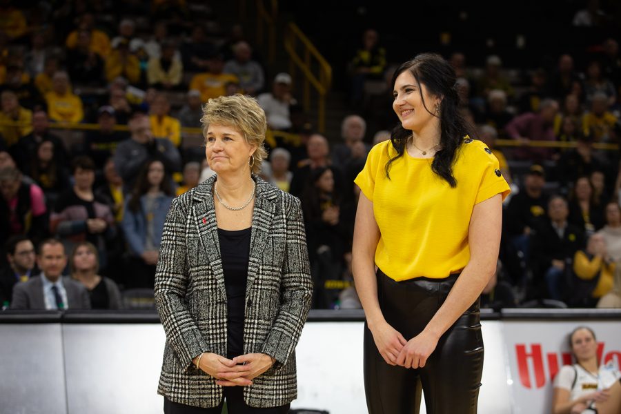 Former+Iowa+basketball+player+Megan+Gustafson+stands+with+head+coach+Lisa+Bluder+during+the+retirement+ceremony+for+her+number+10+jersey+following+the+Iowa+womens+basketball+game+against+Michigan+State+University+on+Jan.+26+at+Caver-Hawkeye+Arena.+The+Hawkeyes+defeated+the+Spartans%2C+74-57.+