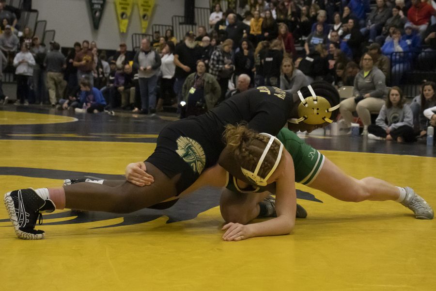 Iowa City West semifinalist Mami Selemani wrestles with an opponent during The 2020 Iowa Wrestling Coaches and Officials Association Girls State Wrestling tournament at Waverly-Shell Rock High School on Saturday, Jan. 25, 2020. Iowa City West High School competed in their first state tournament and had two girls place in the semifinals. 