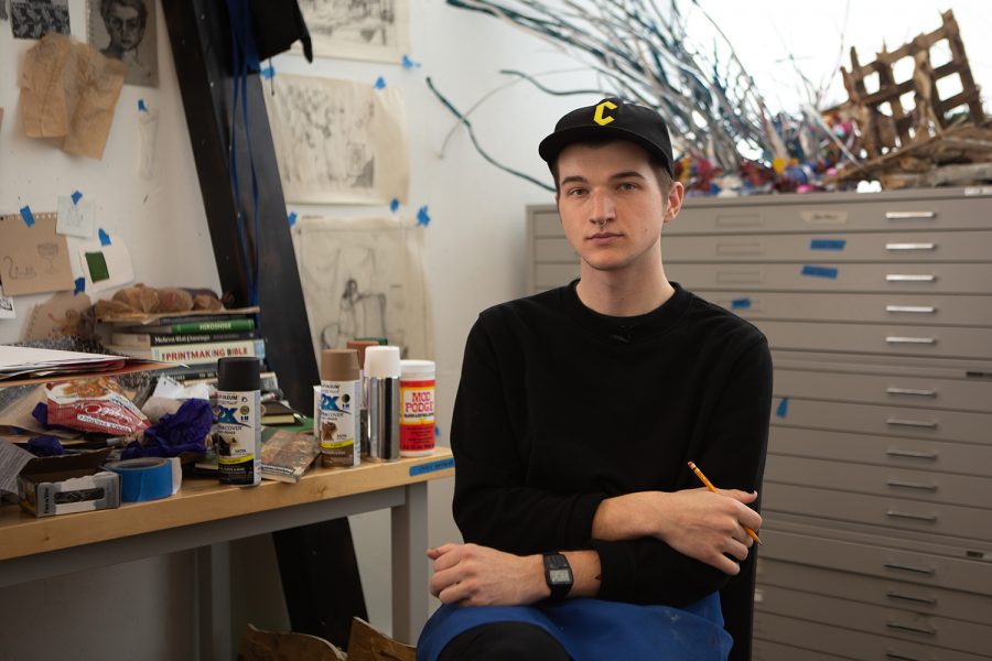 University of Iowa BFA student Casey Mathews poses for a portrait on Friday, Jan. 24, 2020, inside of his studio space located in the Visual Arts building. Mathews is a printmaker and began studying art after taking a general education art class. 