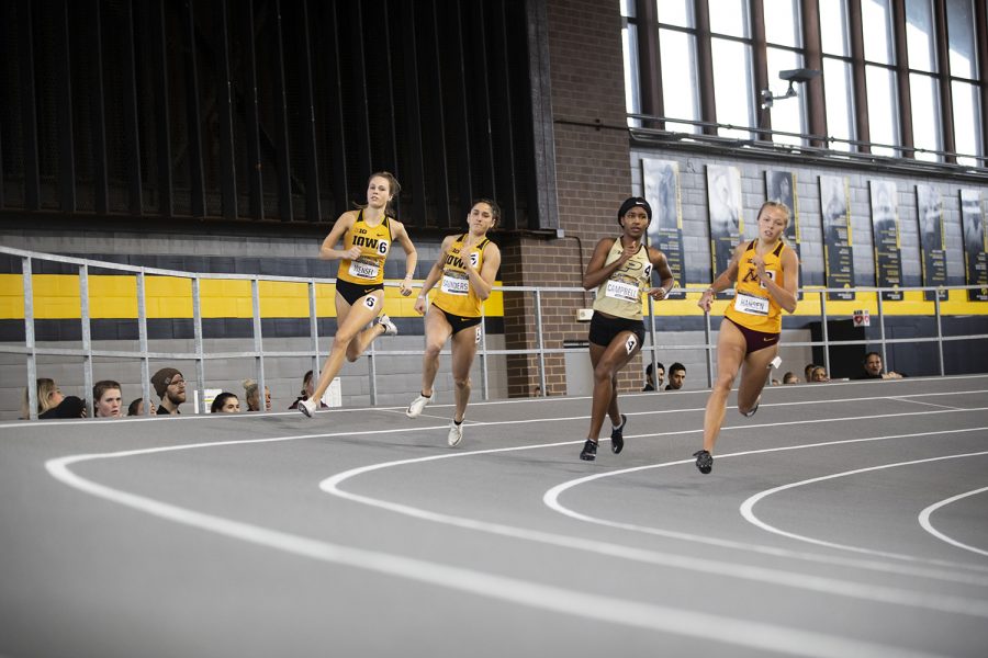 Iowa’s Payton Wensel and Tia Saunders compete in the women’s 400m dash during the fourth annual Larry Wieczorek Invitational at the University of Iowa Recreation Building on Saturday, Jan 18, 2020. 