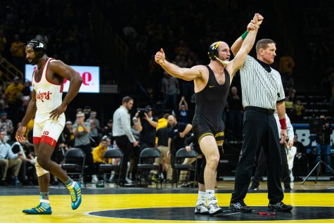 Iowas 165-pound Alex Marinelli defeats Nebraskas Isaiah White during a wrestling dual meet between Iowa and Nebraska at Carver-Hawkeye Arena on Jan. 18. Marinelli won by decision, 4-3, and the Hawkeyes defeated the Huskers, 26-6. 