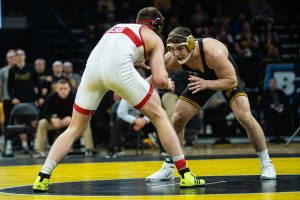 Iowa's 184-pound Abe Assad wrestles Nebraska's Taylor Venz during a wrestling dual meet between Iowa and Nebraska at Carver-Hawkeye Arena on Saturday, Jan. 18, 2020. Assad won by decision, 6-4, and the Hawkeyes defeated the Huskers, 26-6. 