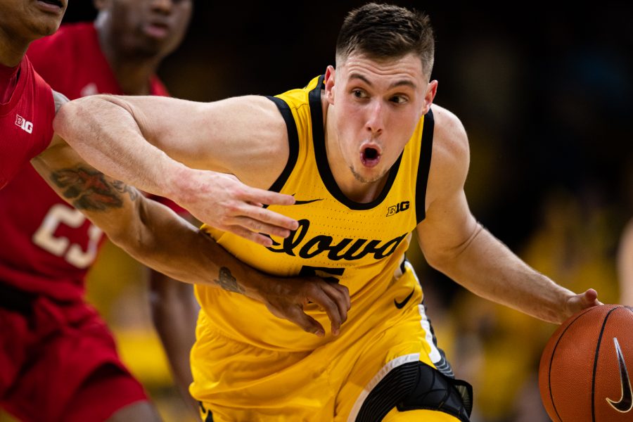 Iowa guard CJ Fredrick dribbles during a men’s basketball game between Iowa and Rutgers at Carver-Hawkeye Arena on Wednesday, Jan. 22, 2020. The Hawkeyes defeated the Scarlet Knights, 85-80. 