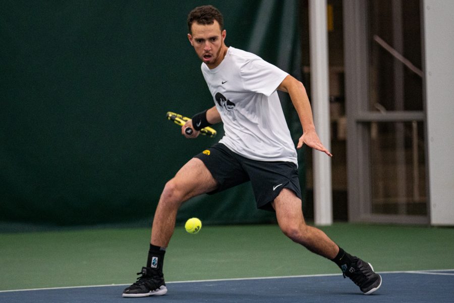 Iowas Kareem Allaf hits a forehand during a mens tennis match between Iowa and Nebraska-Omaha at the HTRC on Saturday, Jan. 25, 2020. The Hawkeyes defeated the Mavericks, 6-1.
