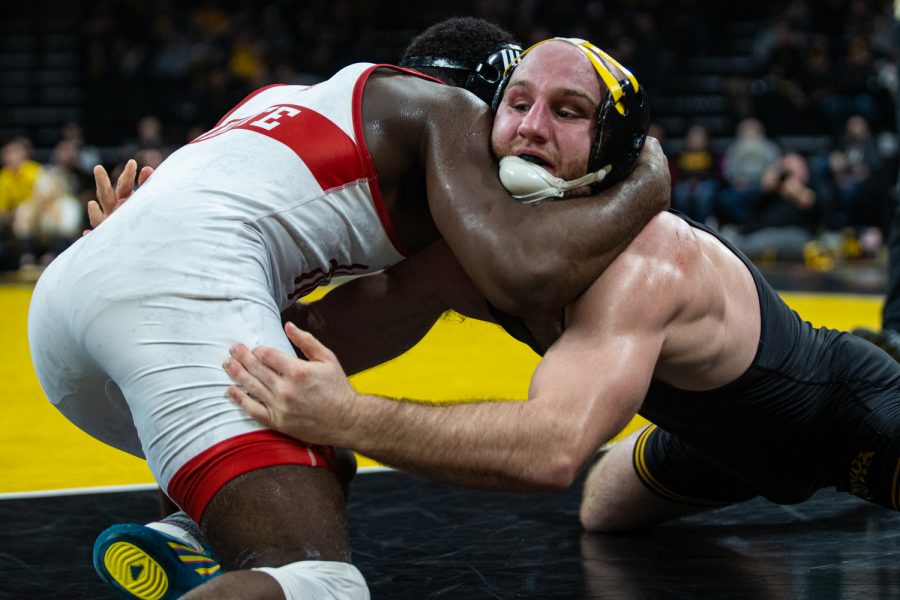 Iowas 165-pound Alex Marinelli wrestles Nebraskas Isaiah White during a wrestling dual meet between Iowa and Nebraska at Carver-Hawkeye Arena on Saturday, Jan. 18, 2020. Marinelli won by decision, 4-3, and the Hawkeyes defeated the Huskers, 26-6.