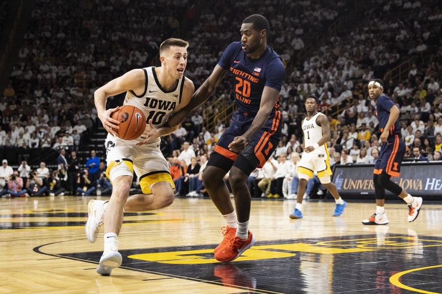 Iowa guard Joe Wieskamp tries to get the ball past Illinois guard Da’Monte Williams during a men’s basketball game between the Iowa Hawkeyes and the Illinois Fighting Illini at Carver-Hawkeye Arena on Sunday, February 2nd, 2020. The Hawkeyes defeated the Fighting Illini 72-65. 