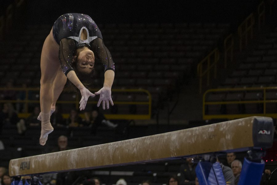 Iowa’s all-around Erin Castle performs on the beam during a gymnastics meet at Carver Hawkeye Arena against Michigan State on Saturday, Feb. 1, 2020. The Hawkeyes won three out of four events against the Spartans with a score, 195.450-195.275. Castle earned a score of 9.750. 