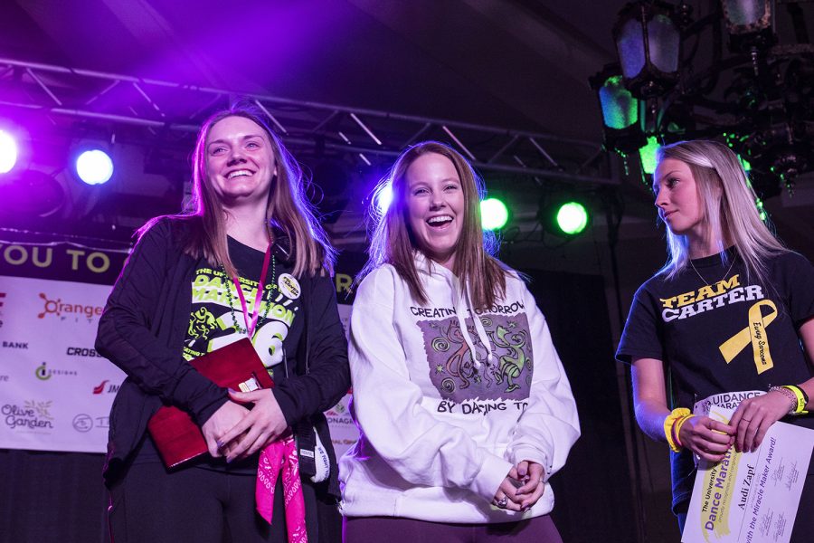 (From left) Haley Talbot, Emily Yeast, and Audi Zapf receives awards for raising the most money of organizers and students during Dance Marathon 26 in the IMU on Saturday, Feb. 8, 2020.  