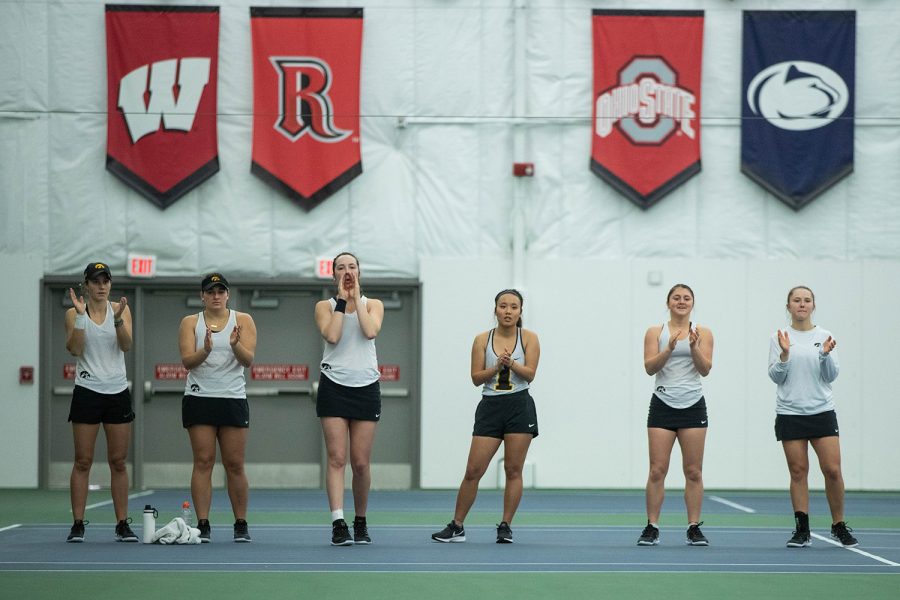 Iowa players cheer on their teammates during a womens tennis match between Iowa and Kansas State at HTRC on Sunday, Feb. 23, 2020. The Hawkeyes defeated the Wildcats 4-3. 