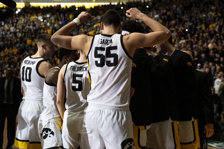 Luka+Garza+flexes+during+a+huddle+before+a+men%E2%80%99s+basketball+game+between+Iowa+and+Penn+State+on+Saturday%2C+Feb.+29+at+Carver-Hawkeye+Arena.+The+Hawkeyes+defeated+the+Nittany+Lions+77-68.+