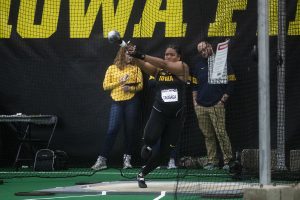 Hawkeye Laulauga Tausago winds up and prepares to throw her weight in the women’s weight throwing competition at the Black & Gold Invitational at the Hawkeye Tennis and Recreation Building on Friday, January 31, 2020. 