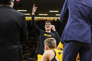 Iowa center Luka Garza reacts to the highlights being shown on the big screen during a timeout during a men’s basketball game between the Iowa Hawkeyes and the Nebraska Huskers at Carver-Hawkeye arena on Saturday, February 8, 2020. The Hawkeyes defeated the Huskers 96-72. 