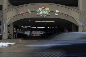 The Iowa City Farmers Market sign is seen above the entrance of Chauncey Swan Parking Ramp on Monday, Feb. 17, 2020.
