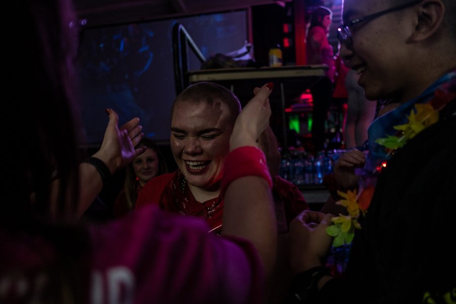 Tessa DeWall hugs another dancer after getting her head shaved during Dance Marathon 26 at the IMU on Saturday, February 8, 2020.